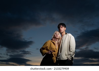 Couple In Love, Sensual Lovers Hugging And Embracing On Dramatic Sky.