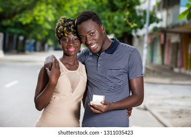 Couple in love, share emotions.Young couple in love outdoors. Concept of love, relationship and people. man asking the hand of a woman on the street in summer - Powered by Shutterstock