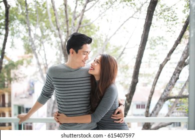 Couple In Love Sharing Genuine Emotions And Happiness, Hugging On The Balcony