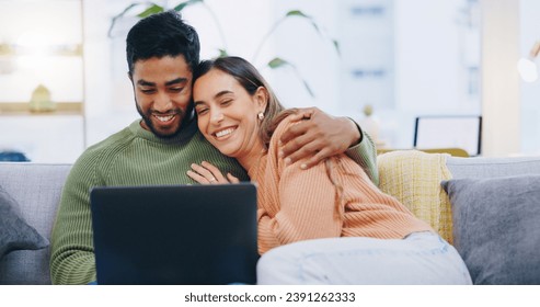 Couple, love and smile with laptop on sofa to watch movies, comedy subscription and online shopping at home. Happy man hug interracial woman at computer to download funny multimedia show in lounge - Powered by Shutterstock