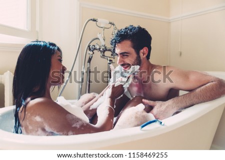 Couple in love spending time together in the house. Romantic moments in the bathroom