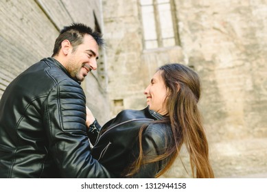 Couple In Love Tickling And Laughing Hard During A Casual Walk Through The City.