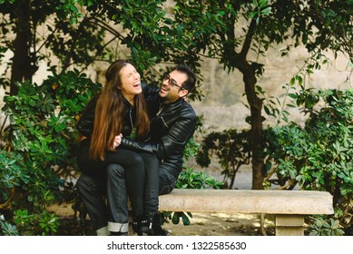 Couple In Love Tickling And Laughing Hard During A Casual Walk Through The City.