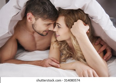 Couple In Love Under The Duvet