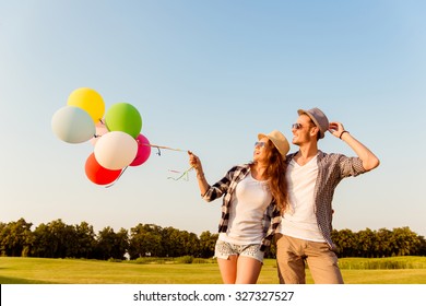 couple in love walking with balloons - Powered by Shutterstock