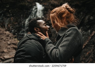 couple in love at the waterfall. couple photo session. interracial couple. waterfall in ukraine in yaremche. model photoset - Shutterstock ID 2259671759