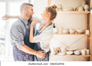 Couple in love working together in potter studio workshop.  - Powered by Shutterstock