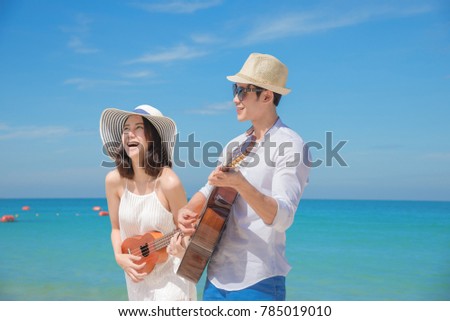 couple lover enjoy song and singing together on the sea beach at honeymoon and valentine occasion