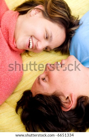 Similar – Image, Stock Photo Happy couple laughing and covering mouths under duvet