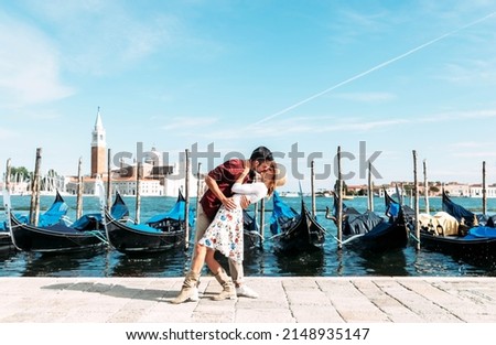 Couple of lovers visiting Venice, Italy - Boyfriend and girlfriend having romantic italian weekend 