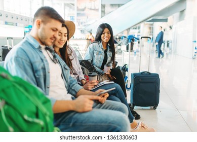 Couple with luggage waiting for departure, airport - Shutterstock ID 1361330603