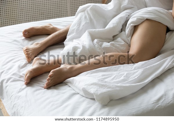 Couple Lying Under White Sheets Bed Stock Photo Edit Now