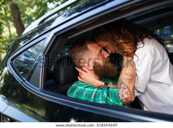 Couple make love in the\
car.