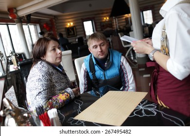 Couple makes an order in a restaurant