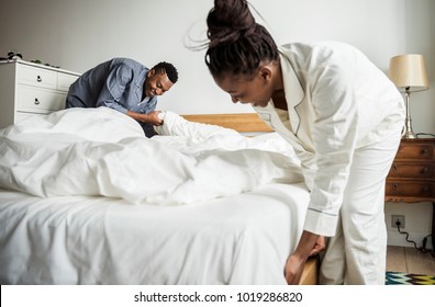 A Couple Making Bed