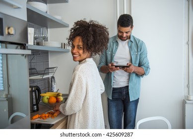 Couple Making Breakfast Together At Home.