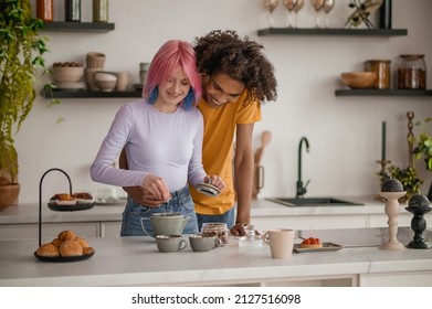 A Couple Making Tea In The Kitchen