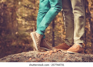 Couple Man And Woman Feet In Love Romantic  Outdoor Lifestyle With Nature On Background Fashion Trendy Style