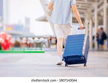 Couple Man Woman traveler with suitcase on businesses centre building  background. - Shutterstock ID 1807143064