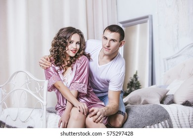 Couple Man And Woman, Young And Beautiful Home In The Bedroom On A Romantic Date Together In Love And Happy