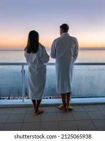 couple man and women drinking coffee during on balcony sunrise at vacation in Cape Town South Africa. 