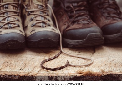 Couple Man And Women Hiking Boots In Love Outdoor. Lifestyle Travel Relationship. Summer Vacations. Woman And Man, Family Trekking Shoes. Laces In Heart Shape. Love To Travel Concept. Outdoor Items.