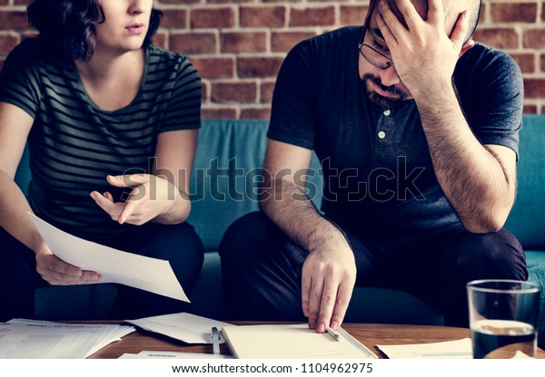 Couple managing the\
debt