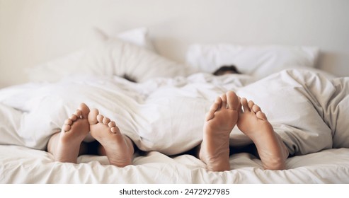 Couple, mattress and feet bedroom for love with duvet in house, peace and morning rest together on holiday. Barefoot people, sleeping and comfort in bed, care and romance under blanket at home - Powered by Shutterstock