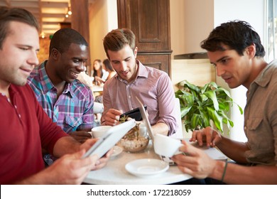 Couple Meeting In Busy Cafe Restaurant