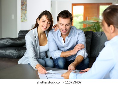 Couple meeting consultant for financial contract