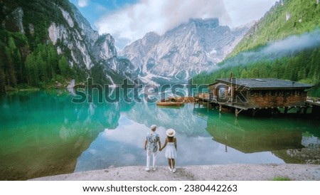 A couple of men and woman visit Braies Lake Lago di Braies Italian Dolomites alpine lake Italy, Europe, men, and women visit Lago Di Braies during vacation summer holiday Stock fotó © 