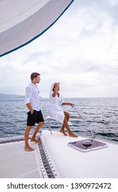 Couple Men And Woman Watching Sunset From Sailing Boat In The Caribbean Sea Near Saint Lucia Or St Lucia