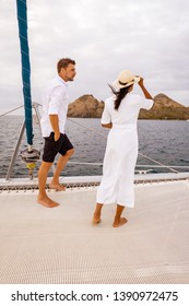 Couple Men And Woman Watching Sunset From Sailing Boat In The Caribbean Sea Near Saint Lucia Or St Lucia