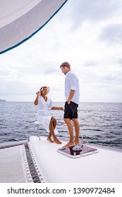 Couple Men And Woman Watching Sunset From Sailing Boat In The Caribbean Sea Near Saint Lucia Or St Lucia