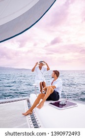 Couple Men And Woman Watching Sunset From Sailing Boat In The Caribbean Sea Near Saint Lucia Or St Lucia