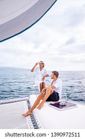 Couple Men And Woman Watching Sunset From Sailing Boat In The Caribbean Sea Near Saint Lucia Or St Lucia