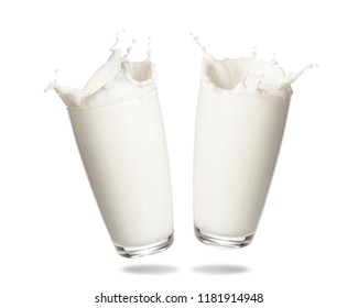 Couple milk splashing out of glass isolated on white background. - Powered by Shutterstock