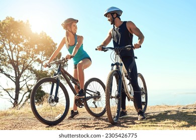 Couple, morning cardio and cycling in the mountains for fitness and exercise together. Bike, wellness and young people with outdoor adventure and sports training with happiness and freedom in sun - Powered by Shutterstock