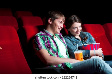 couple in a movie theater, watching a movie - Powered by Shutterstock