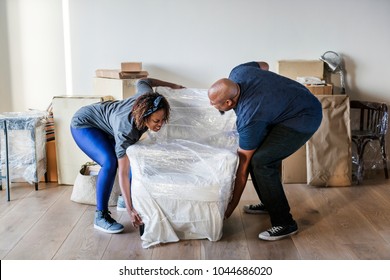 Couple Moving Into New House