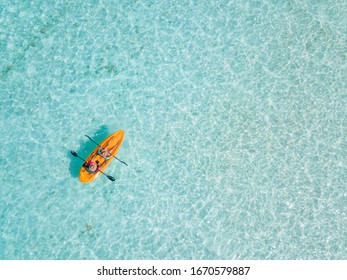 Couple Navigating In Kayak The Bacalar Lagoon, Near Cancun In Riviera Maya, Mexico