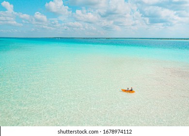 Couple Navigating In Kayak The Bacalar Lagoon, Near Cancun In Riviera Maya, Mexico