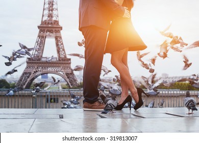 Couple Near Eiffel Tower In Paris, Romantic Kiss