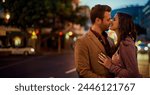 Couple, night and city with hug and kiss on date, romance and bonding with love in relationship. Happiness, affection and people with commitment and trust, sweet moment and romantic together outdoor