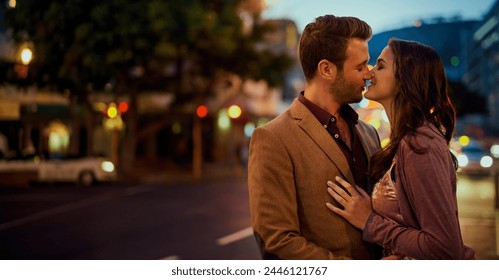 Couple, night and city with hug and kiss on date, romance and bonding with love in relationship. Happiness, affection and people with commitment and trust, sweet moment and romantic together outdoor - Powered by Shutterstock