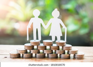 Couple Older Model Standing On Money Coins Saving For Concept Investment Mutual Fund Finance And Pension Retirement