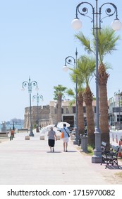 Couple Of Older People Walking In Foinikoudes, Larnaca