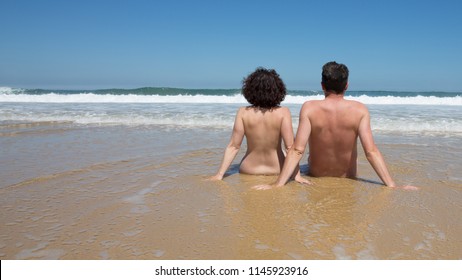 Couple On The Beach Doing Nudism Vacation Naturism Holidays