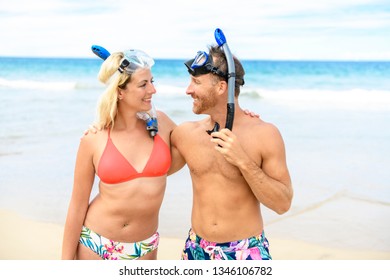 Couple On The Beach Is Going To Swim And Snorkle On Hawaii Beach