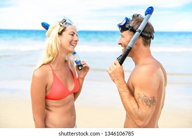 Couple On The Beach Is Going To Swim And Snorkle On Hawaii Beach